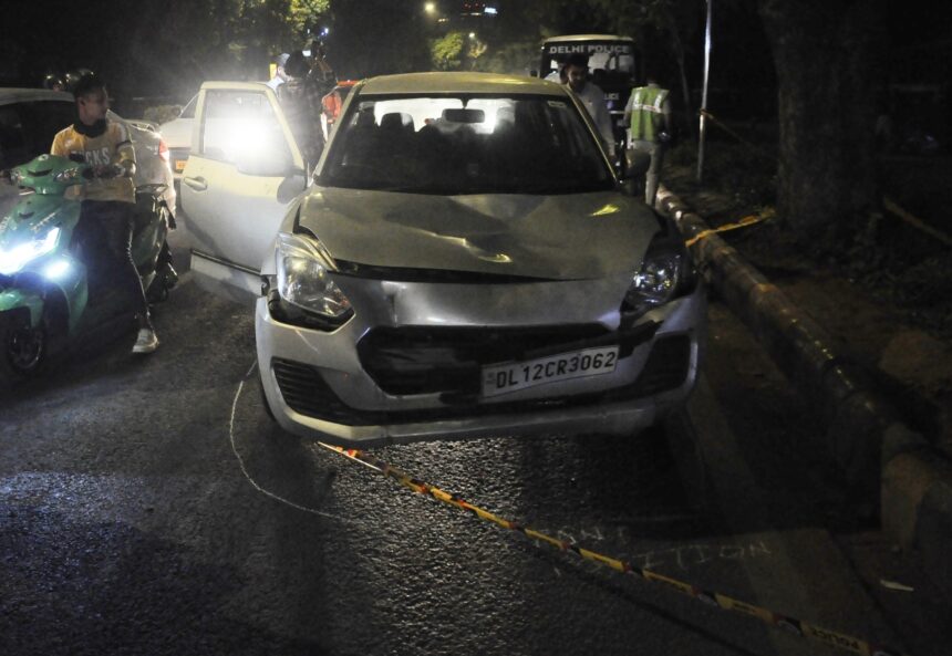 A damaged swift car which hit a cycle rickshaw and dragged it
