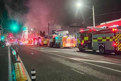 Fire trucks are seen near the site where a fire broke out in downtown Wellington