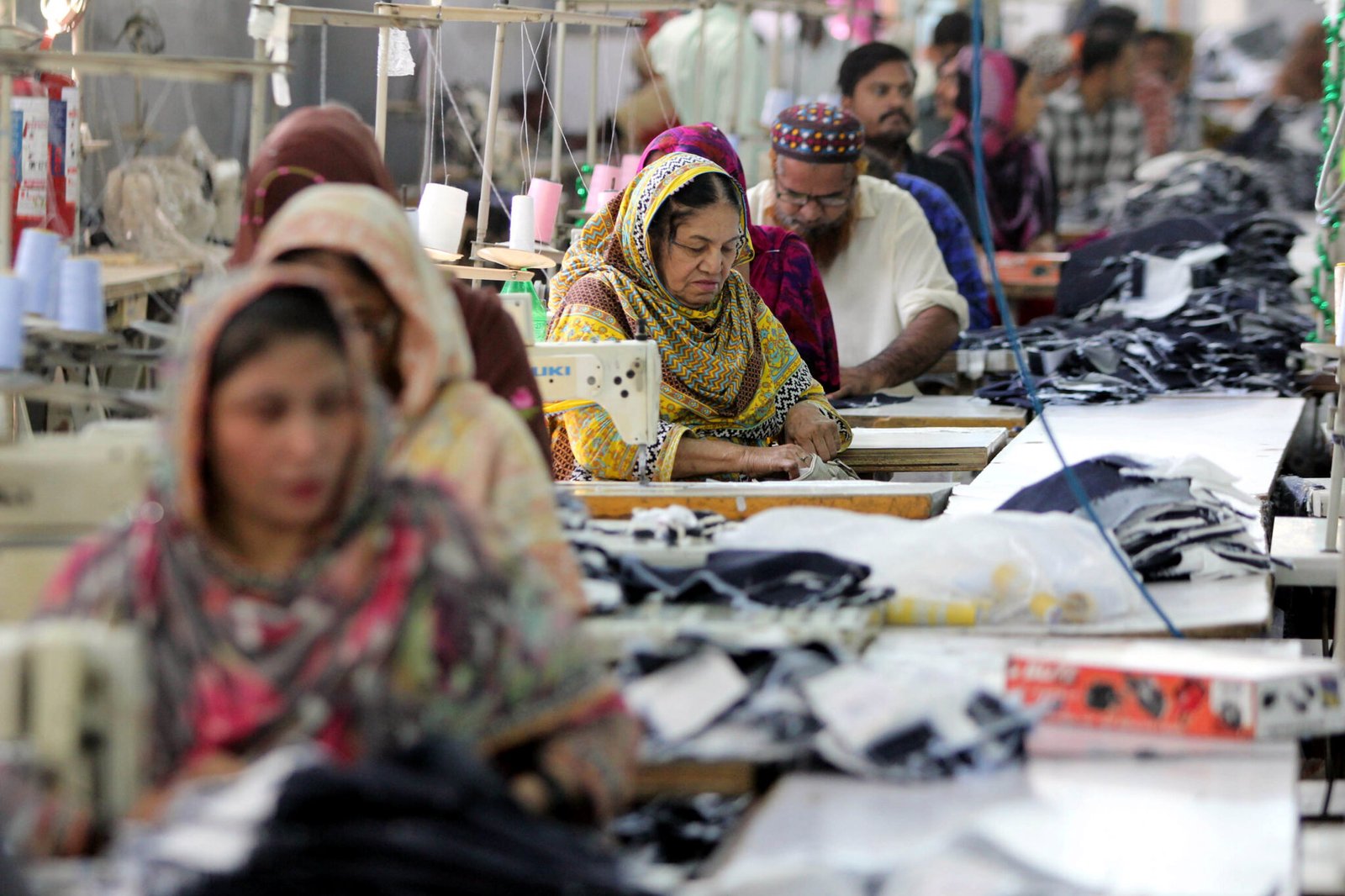 Laborers work in a garment factory