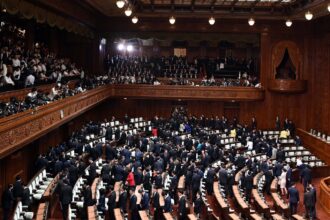 Lawmakers leave after Japanese Prime Minister Shinzo Abe dissolved the House of Representatives in Tokyo
