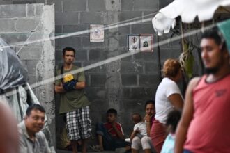 Migrants at a migrant camp in Reynos