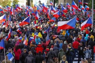 People take part in a demonstration at Wenceslas Square in Prague