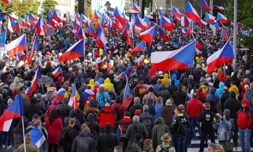 People take part in a demonstration at Wenceslas Square in Prague