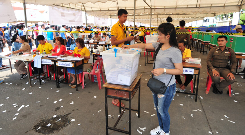 People vote at a polling station