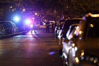 Police officers stand guard near the shooting scene in Washington D.C