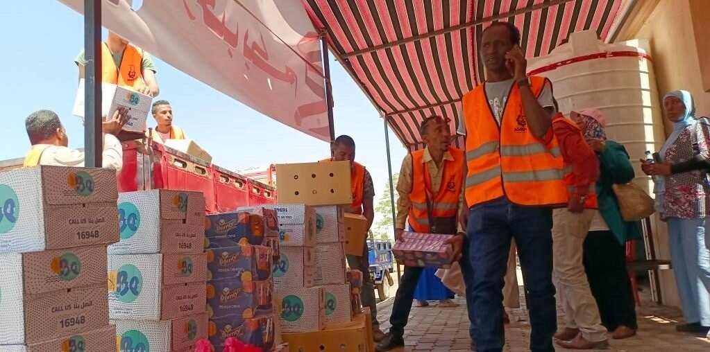 Staff members prepare supplies for refugees from Sudan