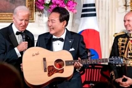 U.S. President Joe Biden (L) gifts South Korean President Yoon Suk Yeol