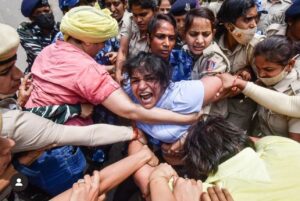 Wrestler Sakshi Malik being detained by police