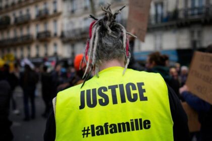 A person participates in a protest against a pension reform bill in Paris
