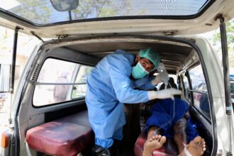 An injured man receives treatment