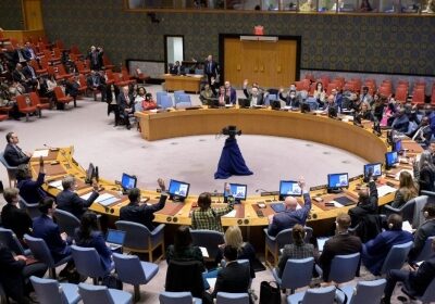 Representatives vote on a draft resolution during a UN Security Council meeting at the UN headquarters in New York