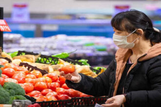 A customer shops vegetables