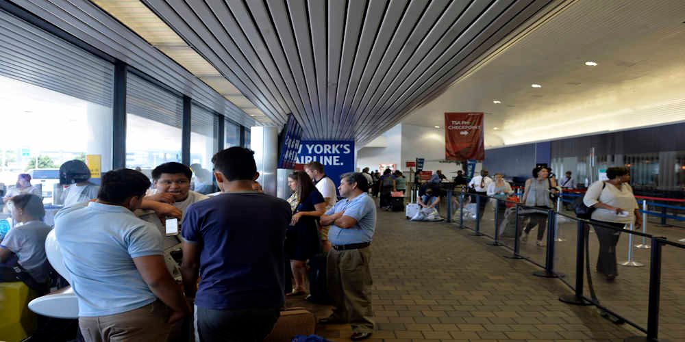 Passagers wait at LaGuardia Airport