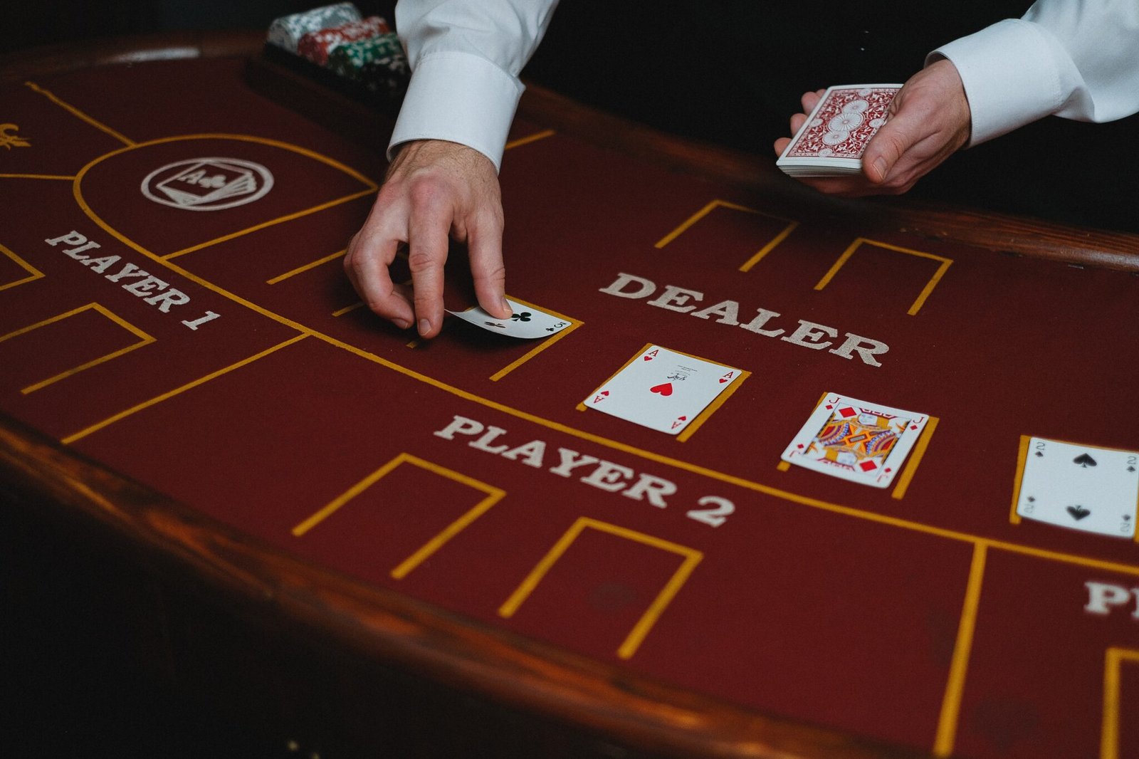 Image Source: https://www.pexels.com/photo/croupier-with-cards-in-casino-6664126/